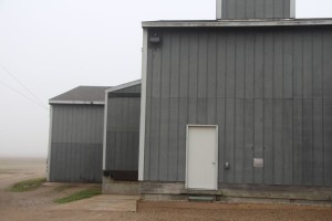 Gray buildings at Carlson-Arbogast bean farm